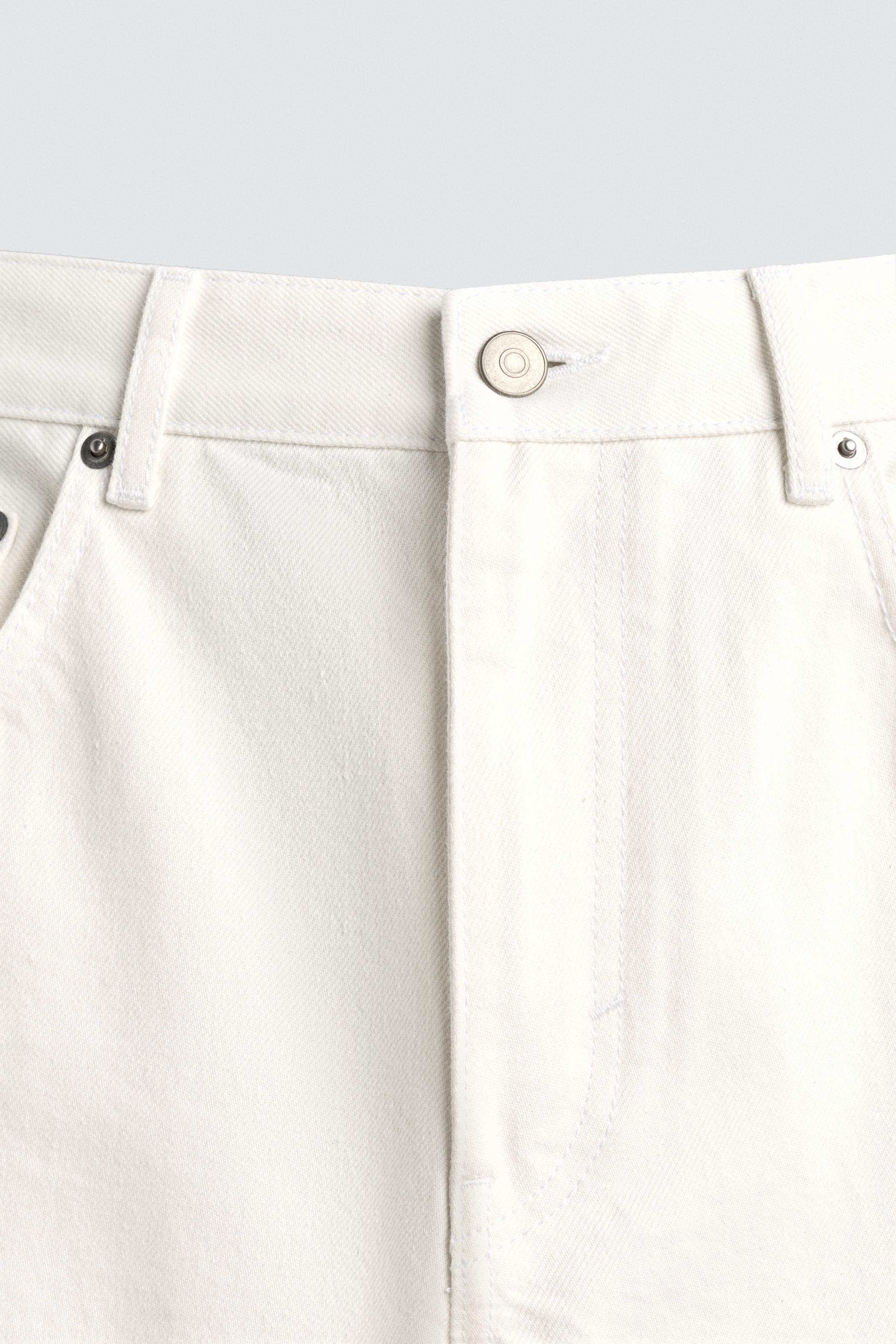 IRREGULAR HEM STRAIGHT FIT JEANS